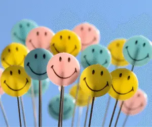 STEAM Saturday 5-31-2025 - Critchlow Adkins Children's Centers A bunch of pink, blue, and yellow smiley face lollipops