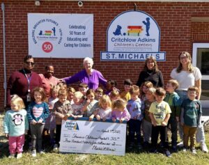 490266228_10235003614501535_616323356473218114_n - Critchlow Adkins Children's Centers Group of children and adults posing with a big check
