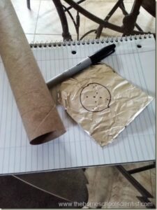 supplies to make a homemade constellation viewer: paper towel roll, foil, sharpie, and paper