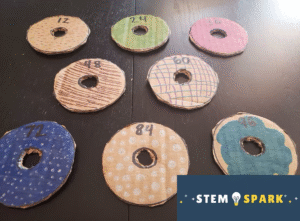 Donuts made out of cardboard and colored with bright colored markers