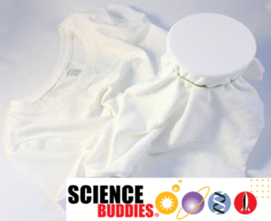 white t-shirt with a spot stretched over a cup and fastened with a rubber band