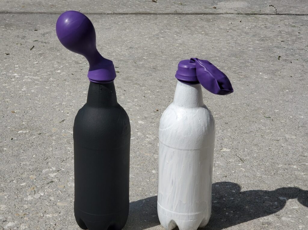 black and white bottles with balloons